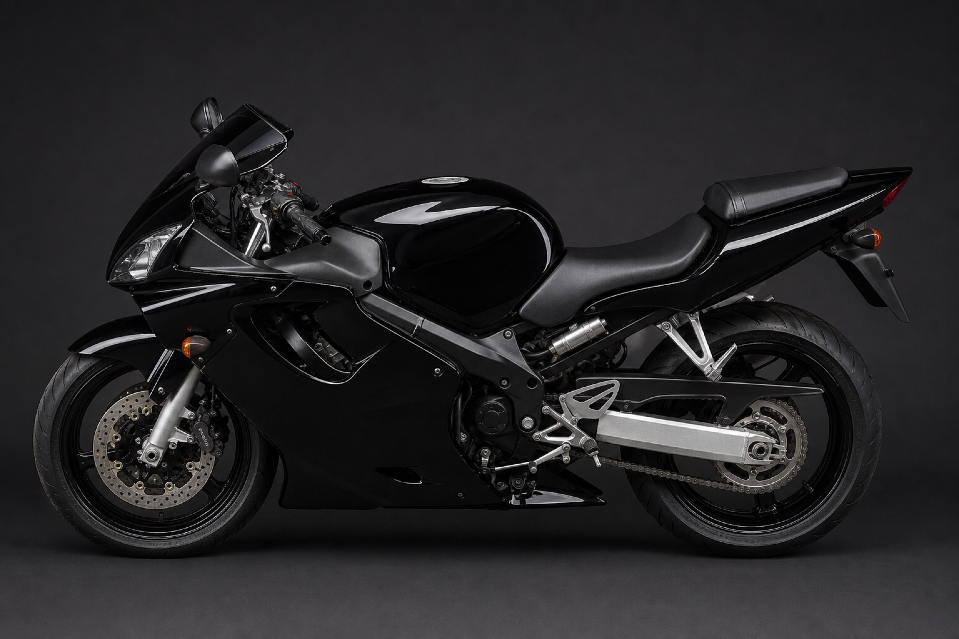 Sport bike in a gloss-black colour-change wrap, left profile