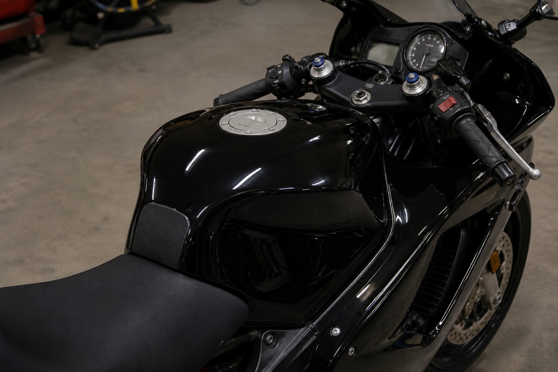 Tank and cockpit detail with protective film under the rider's knees